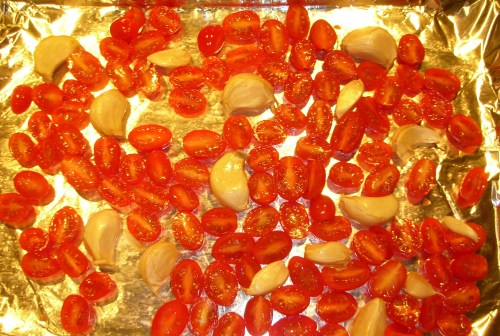 grape tomatoes, cut-side up, ready for the oven