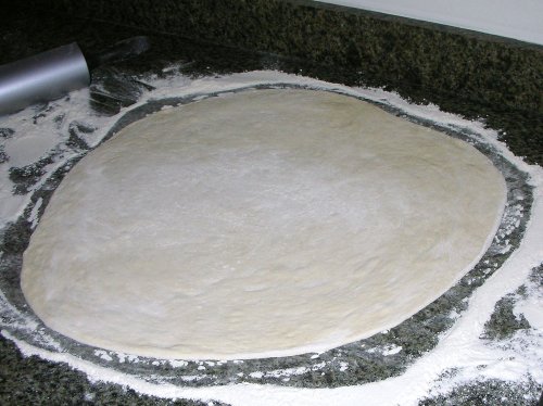 pita dough, rolled out